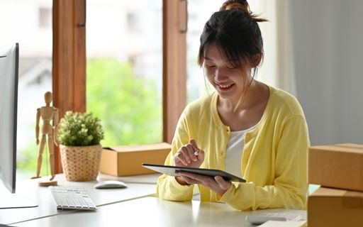 business owner looking at tablet